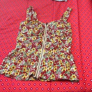 T- shirt is flower print . Size is small and brand is liberty love.